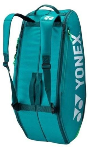 The Yonex 92426EX 6 Racket Pro Badminton Bag in dark green features backpack straps, a top handle, side zippers, and the Yonex logo printed in white—ideal for carrying up to 6 rackets or your badminton gear.