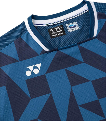 Close-up of the Yonex 10712YX Crew Neck Men’s Badminton T-Shirt in Indigo Blue, featuring geometric navy and blue patterns and a white Yonex logo on the chest. This quick-drying sports shirt has tag details inside the collar.