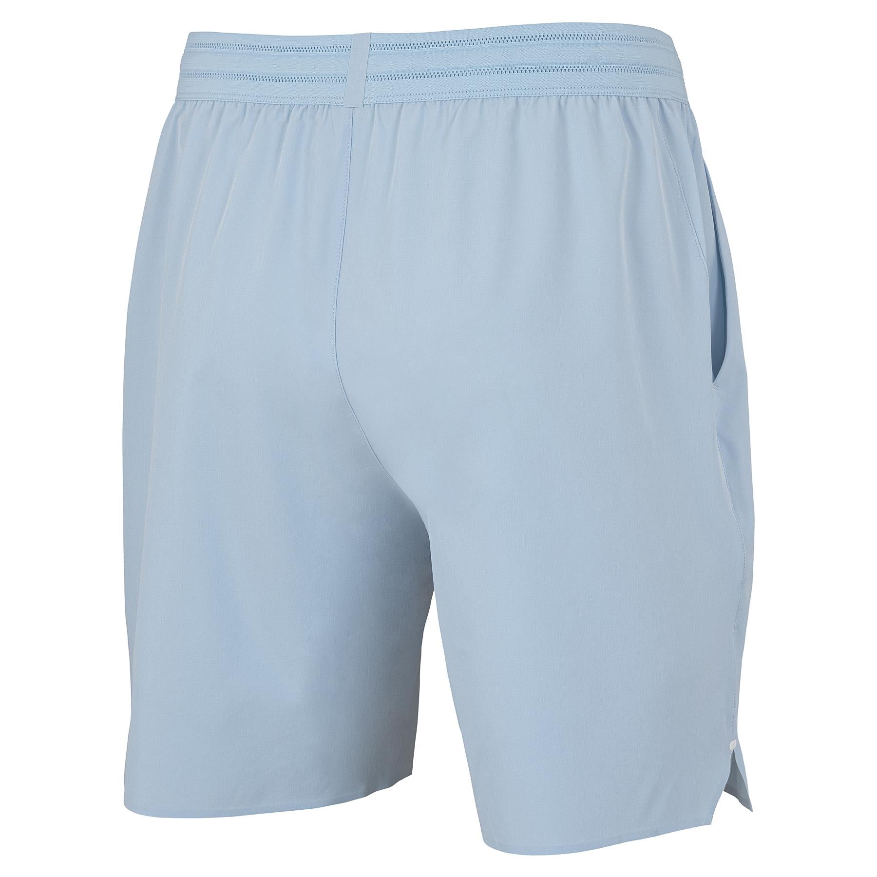 Tecnifibre Team Stretch Men's Badminton Shorts in Glacier Blue feature an elastic waistband, side pockets, and a relaxed fit. Made from smooth, breathable fabric—perfect for sports or casual wear. Back-side view shown.