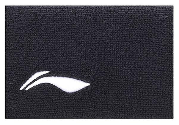 The Li-Ning Corner Logo Wristband in black features a textured fabric with a small, white, stylized leaf or wing logo on the lower left. It provides superior perspiration control ideal for badminton players.
