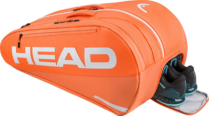 The HEAD Tour 12 Racket Badminton Bag XL in orange features multiple compartments and climate control technology; one pocket is partly open, revealing black and teal athletic shoes. The white HEAD logo stands out on the bag.