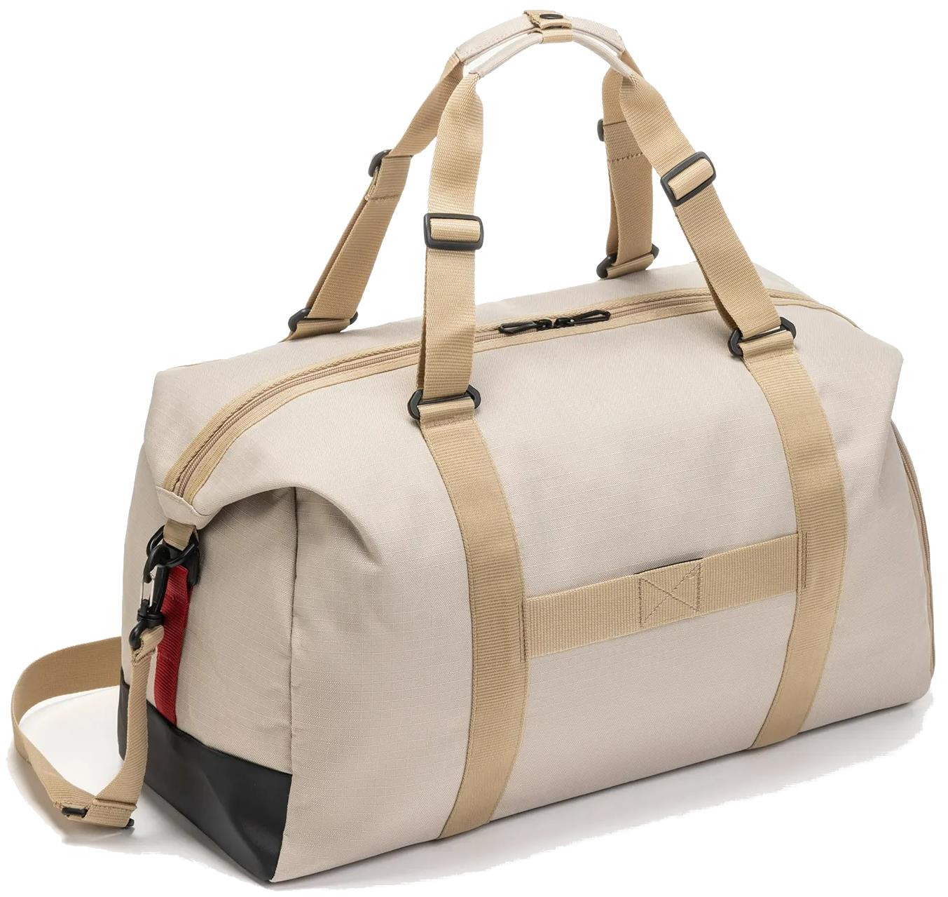 The Yonex BA72611EX Gearlogic Badminton Boston Bag in beige features tan straps, black accents, a zippered main compartment, side pocket, detachable shoulder strap, and is made from recycled polyester for a modern look.