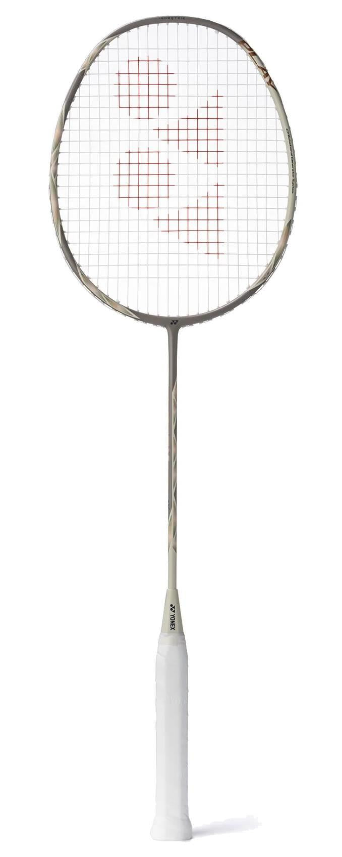 The Yonex Astrox 77 Play 4U Badminton Racket in Light Beige by Yonex features a slim graphite shaft, circular head with red string markings, and white grip, displayed against a white background.