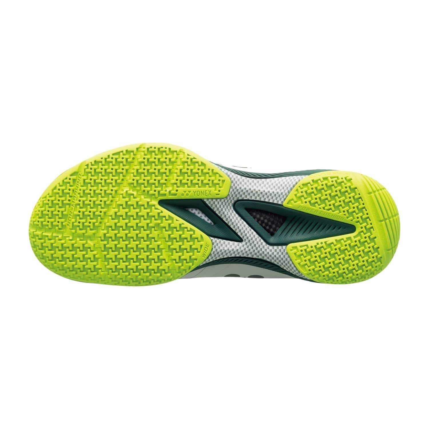 The image shows the Yonex Power Cushion 65Z4 Viktor Axelsen Men's Wide Badminton Shoe in White/Lime, with a bright yellow-green tread for grip, black arch support, and signature Viktor Axelsen branding.