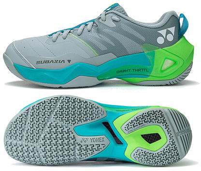 A pair of Yonex Subaxia GT 2026 Women's Badminton Shoes in grayish green is shown from the side and bottom; featuring Yonex branding on the side and a textured sole with GRPHT THRTTL technology for improved grip.