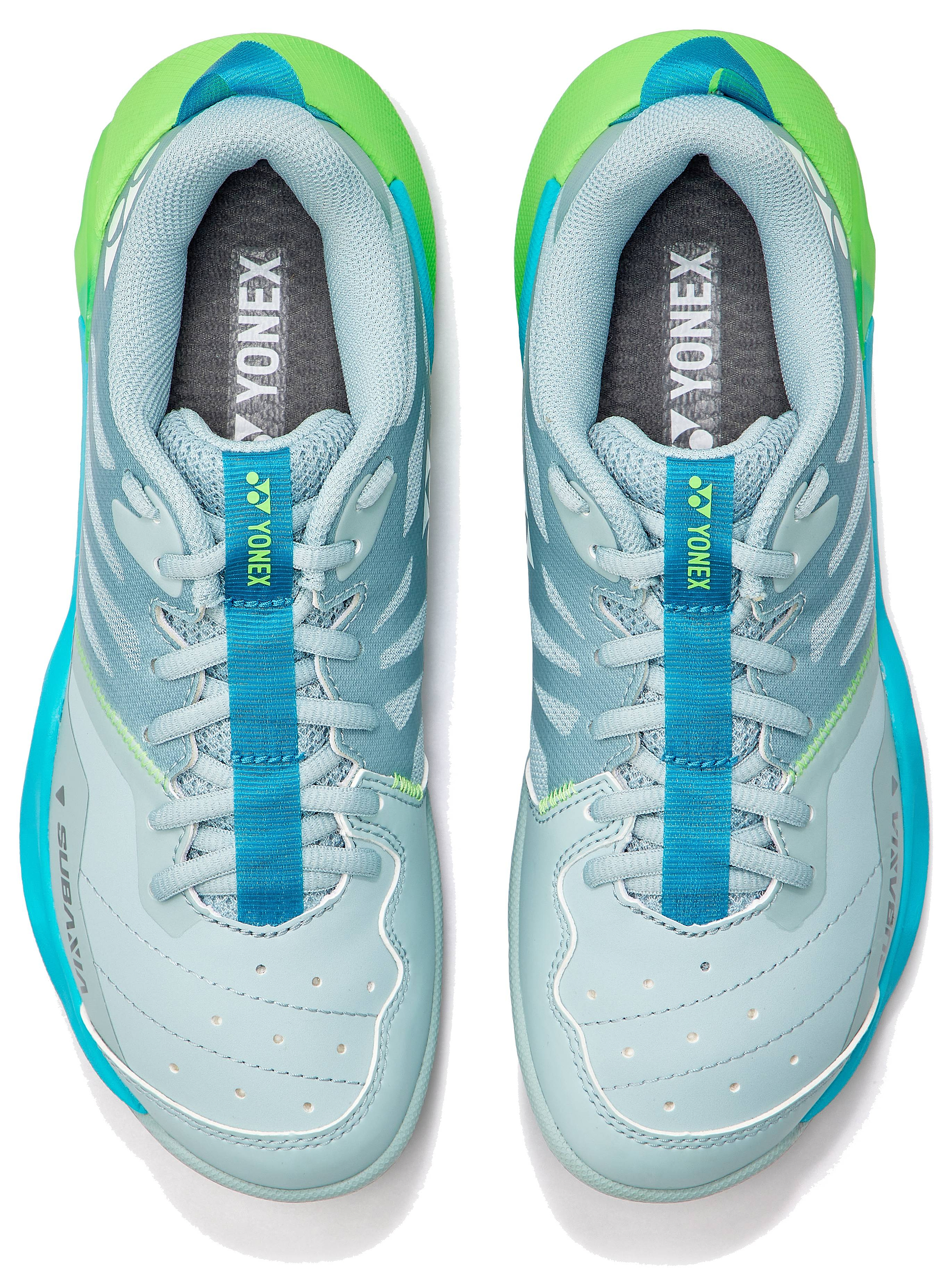 A pair of Yonex Subaxia GT 2026 Women's Badminton Shoes in grayish green, viewed from above. With white laces, perforated toes, Yonex branding, and GRPHT THRTTL tech for advanced badminton performance.