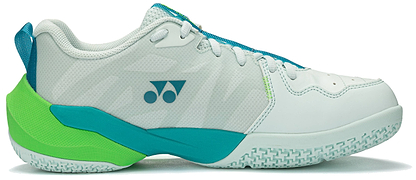 The Yonex Subaxia GT 2026 Mens Badminton Shoes in pale green feature mesh panels, a textured sole with GRPHT THRTTL tech for better performance, and a blue Yonex logo with two dots and a triangle on the side.