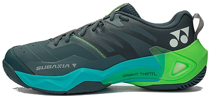 The Yonex Subaxia GT WIDE 2026 Unisex Badminton Shoes in dark green feature teal and bright green accents, a chunky sole, the Yonex logo on the heel, and "SUBAXIA" on the side—ideal for sports or training.