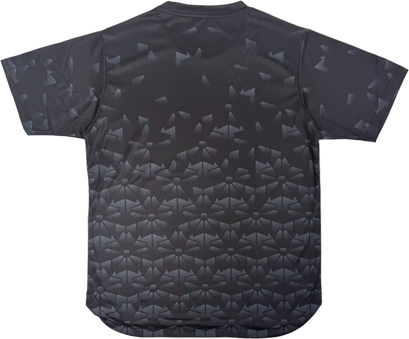The Yonex YTM2025B Men's Badminton T-Shirt in black features short sleeves and a subtle geometric pattern of glossy triangles, shown from the back against a white background.