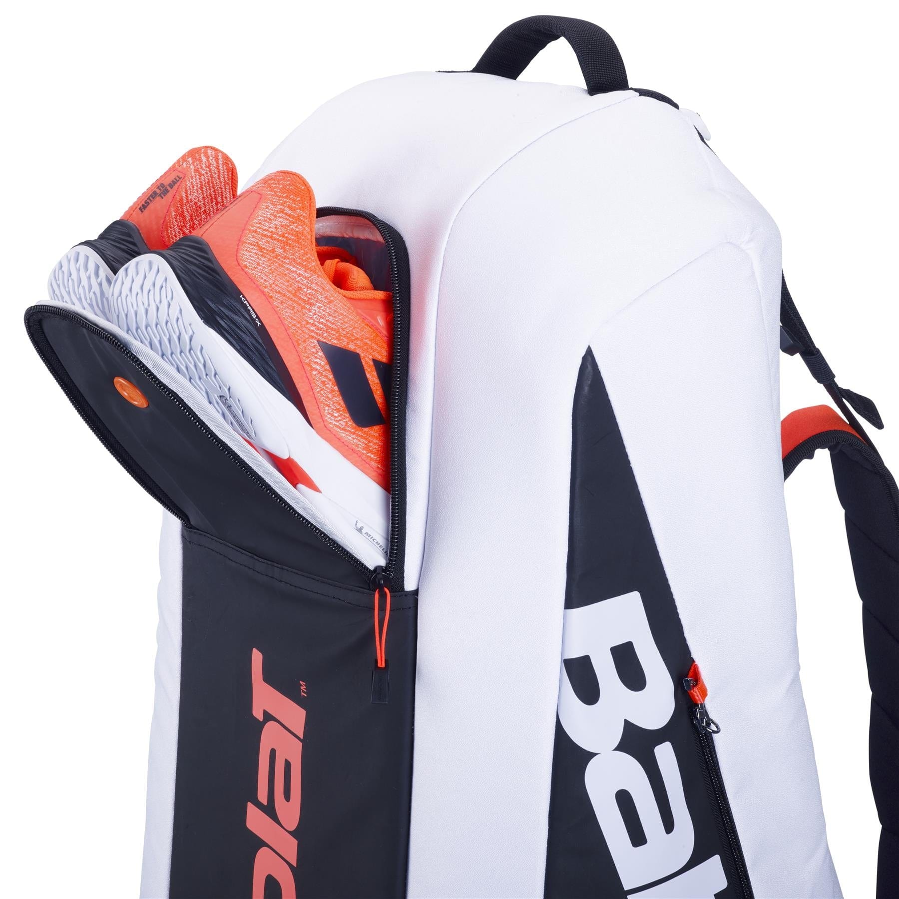 The Babolat RH6 Pure Strike 4th Gen 6 Racket Badminton Bag, made with isothermal material, is slightly open with vibrant orange sports shoes inside. Designed in white, black, and red accents, it also displays the Babolat logo on the side. It's ideal for carrying essentials like your badminton racket or other gear.