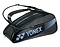 The Yonex 82426EX Active 6 Racket Badminton Bag in black showcases blue accents and the distinctive Yonex logo. It includes a dedicated shoe compartment, multiple zippers for convenient access, and two comfortable shoulder straps for easy carrying.