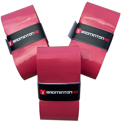Three red BadmintonHQ overgrips with black "BADMINTON HQ" bands are shown on a white background, providing ultra-tacky grip and sweat absorption for better performance.
