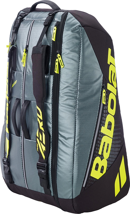 The Babolat RH12 Pure Aero 12 Racket Badminton Bag in grey and yellow features multiple zippered compartments, backpack straps, and displays the Babolat logo on the side.