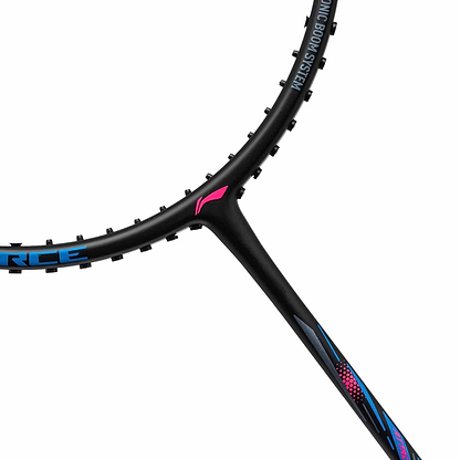 Zoomed-in view of the Li-Ning Axforce Big Bang 6U badminton racket in black, showcasing blue and pink details. The emphasis is on the Y-joint where the Ex-Light frame seamlessly connects to its stylish, contemporary design. Featuring distinct brand elements, it boasts a striking high-contrast finish that epitomizes precision and innovation.