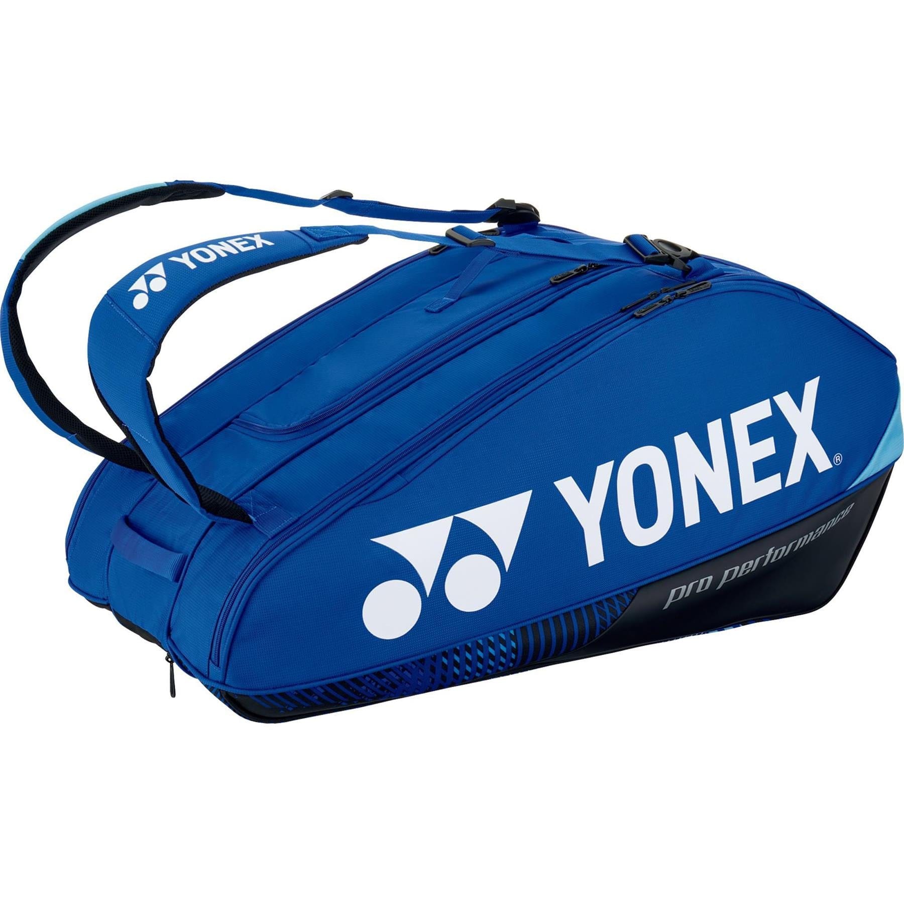 The Yonex 92429EX 9 Racket Pro Badminton Bag in cobalt blue, featuring black accents and the iconic logo, prominently displays "Pro Performance" text. It is equipped with YKK zippers and a Thermo Guard lining, providing multiple compartments and dual shoulder straps for convenient carrying.