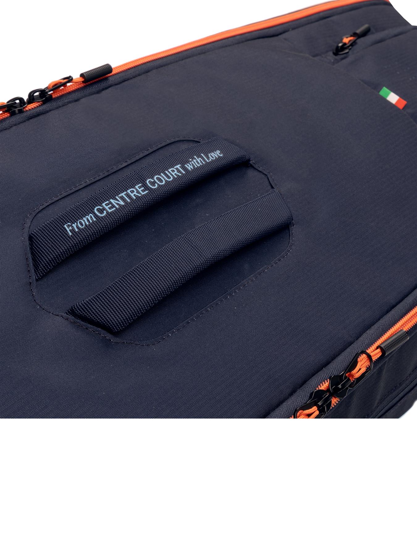 Close-up of the HEAD Pro 9 Racket Badminton Bag L - Navy by HEAD featuring orange zippers, CCT+ climate control, a handle with "From CENTRE COURT with Love," and a small Italian flag patch nodding to Jannik Sinner.