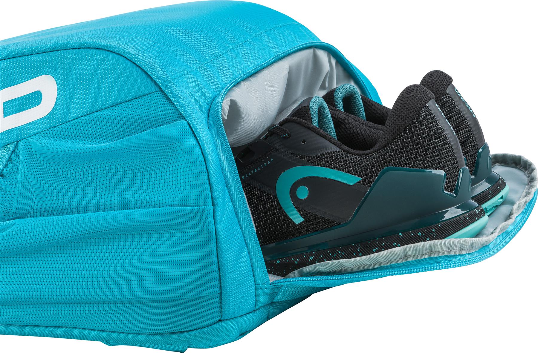 A pair of black sports shoes with teal accents are partially packed inside an open, bright blue HEAD Tour 25L Badminton Backpack by HEAD, a stylish bag featuring visible side pockets.