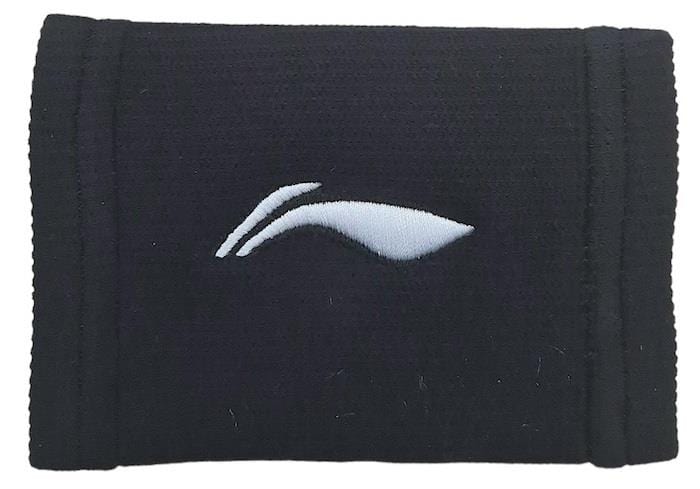 The Li-Ning Central Logo Wristband in black features a minimalist white logo with two curved lines or a stylized swoosh in the center. Ideal for badminton players, its slightly ribbed texture provides comfort and improved grip during intense matches.