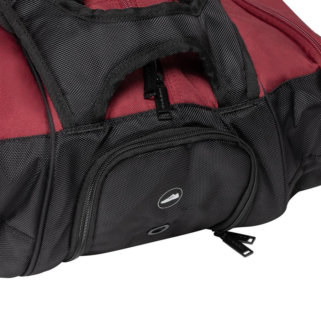 The Dunlop CX Performance 12 Badminton Racket Bag in black and red boasts a textured fabric design, making it ideal for racket storage. It features a top handle, a zippered front pocket with black zippers, a small circular logo on the pocket, and ergonomic shoulder straps for easy carrying.