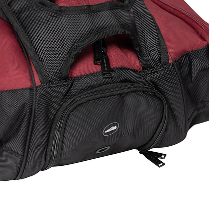 The Dunlop CX Performance 12 Badminton Racket Bag in black and red boasts a textured fabric design, making it ideal for racket storage. It features a top handle, a zippered front pocket with black zippers, a small circular logo on the pocket, and ergonomic shoulder straps for easy carrying.