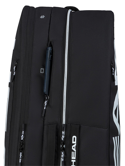 A close-up of the HEAD Tour 9 Racket Badminton Bag L - Black by HEAD shows multiple zippered compartments, white accents and branding, CCT+ climate control, and a partially open pocket revealing a smartphone.