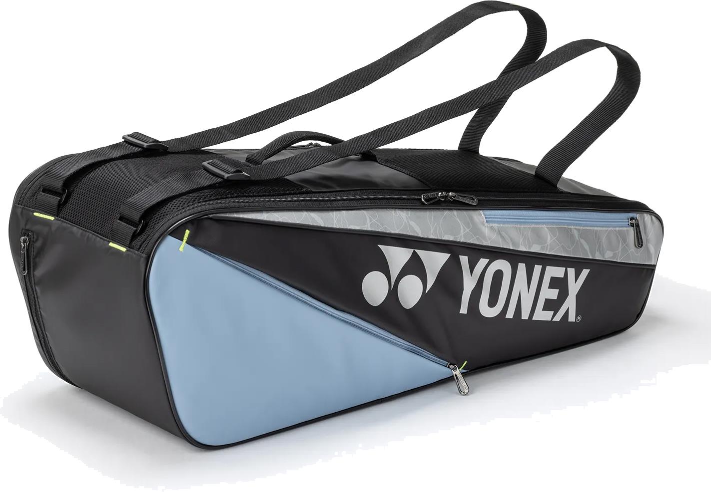 The Yonex BA52526EX Club 6 Racket Badminton Bag in black and blue features shoulder straps, a visible zipper pocket, and the Yonex logo in white—perfect for carrying your gear as a durable badminton racket bag.