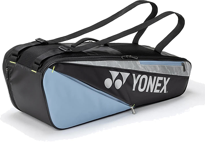 The Yonex BA52526EX Club 6 Racket Badminton Bag in black and blue features shoulder straps, a visible zipper pocket, and the Yonex logo in white—perfect for carrying your gear as a durable badminton racket bag.