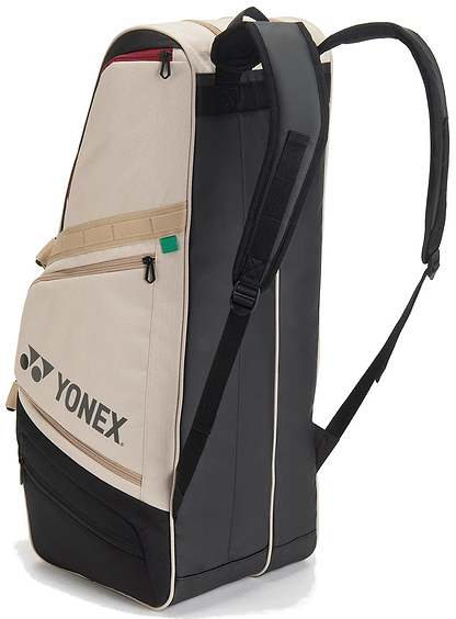 The Yonex BA72626EX Gearlogic 6 Racket Badminton Bag in beige is made from recycled polyester, includes a strap, and conveniently holds up to 6 rackets.