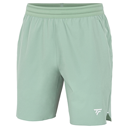 The Tecnifibre Team Stretch Men's Badminton Shorts in sage green feature an elastic waistband, lightweight breathable fabric, and a small white logo on the lower left leg.