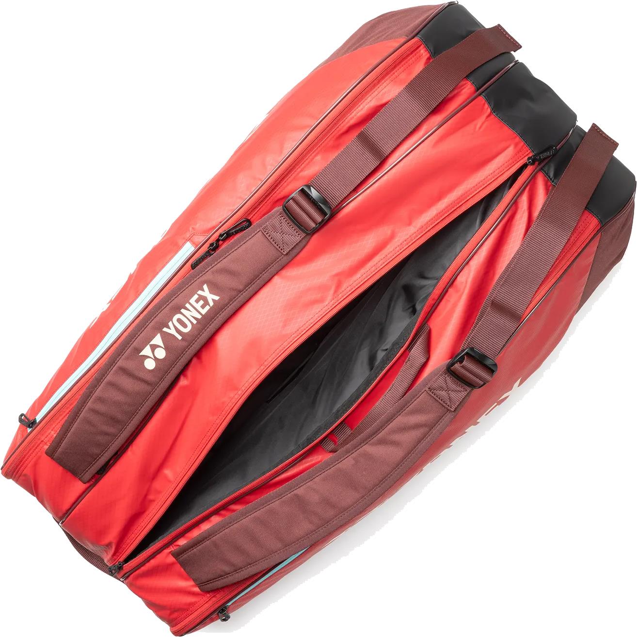 The Yonex 42529EX Team 9 Racket Badminton Bag in Ruby Red features multiple compartments and a spacious interior—ideal for organizing your gear.