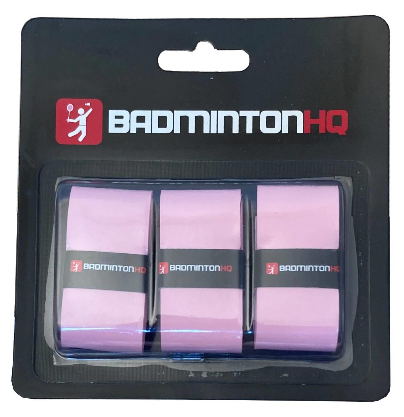 The BadmintonHQ 3 Pack Badminton Overgrips in pink come in black packaging labeled "BadmintonHQ" and feature a white and red logo of a badminton player.