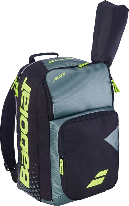 The Babolat Pure Aero 2026 Badminton Backpack in grey and yellow features the Babolat logo, a large front pocket, and a separate racket compartment with space for your racquet to stick out at the top.