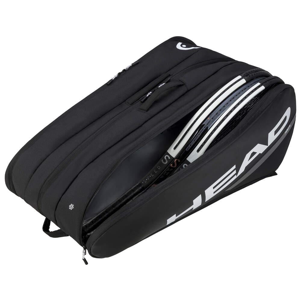 A black HEAD Tour Badminton Racket Bag XL, showcasing multiple compartments and a backpack carrying system, is partially unzipped to reveal the strings and edge of a badminton racket inside. The bag prominently features the brand logo "HEAD" in large white letters on its side.