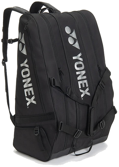 The Yonex BA726212EX Gearlogic 12 Racket Badminton Bag - Black features three zippered compartments, shoulder straps, and white Yonex logos—ideal for securely carrying all your badminton gear to tournaments.