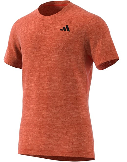 The ADIDAS Mens Freelift Badminton T-Shirt in vibrant red, from the adidas brand, is designed with a small black logo on the left chest. It features AEROREADY fabric for optimal performance and a textured short sleeve design. The item is showcased against a white background.