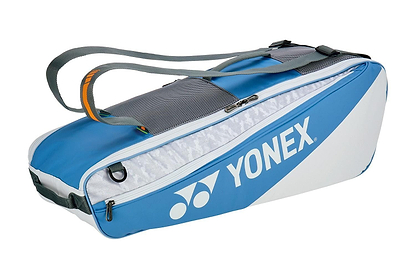 The Yonex 52526EX Club 6 Racket Badminton Bag in greyish blue has a large main compartment, shoulder straps, a zippered pocket, and displays the Yonex logo on the side. Perfect for enthusiasts.