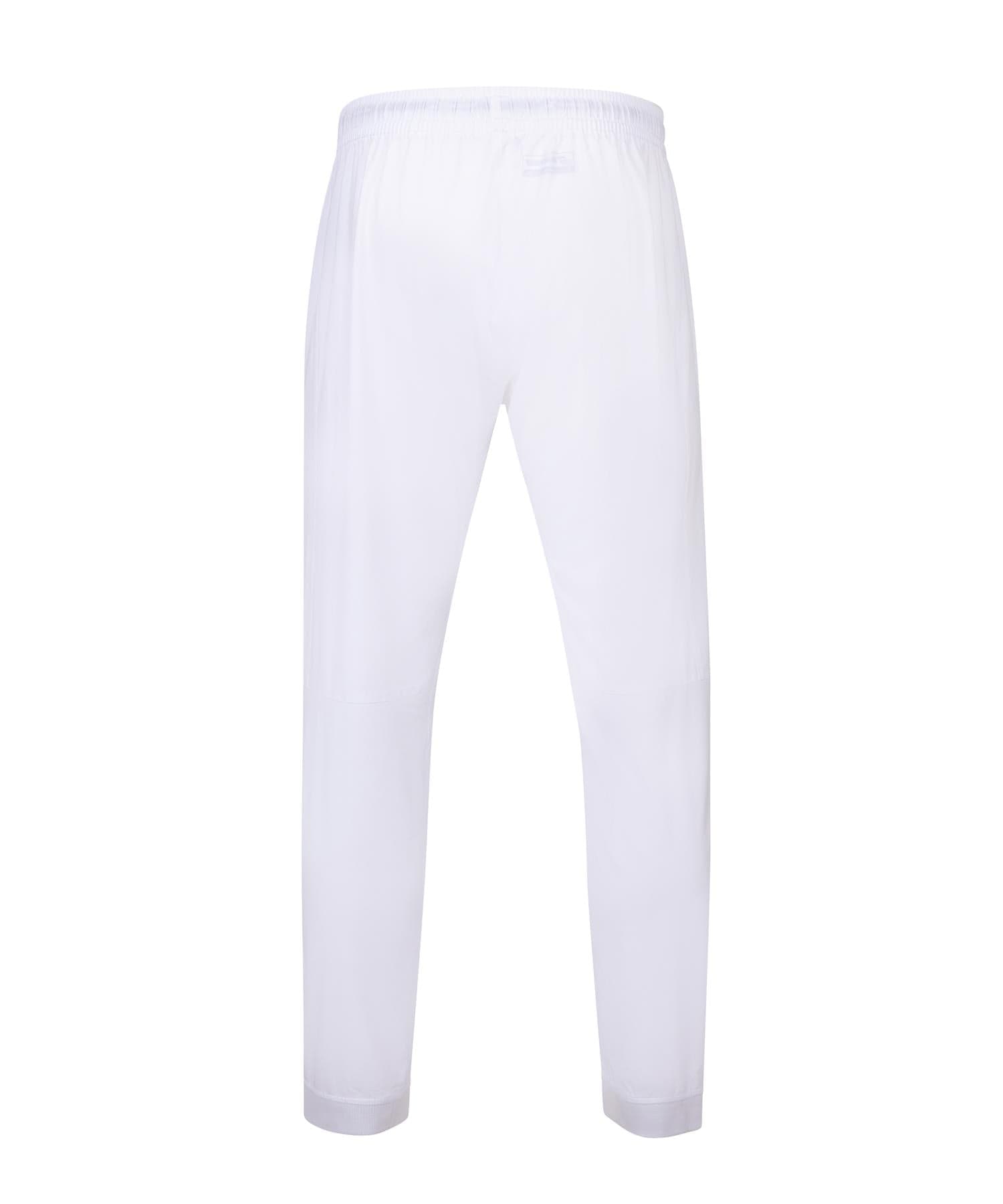 The Babolat Play Men's Badminton Pants in white feature a minimalist design with an elastic waistband, shown from the back. Crafted from four-way stretch fabric, they provide a lightweight feel and timeless style, making them ideal for both on-court performance and casual occasions.