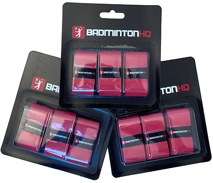 Three packs of BadmintonHQ 3 Pack Badminton Overgrips in red, each pack containing three grips with excellent sweat absorption, are shown overlapped on a white background in black and white BadmintonHQ packaging.