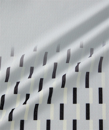 Close-up of the Yonex 10713EX Crew Neck Men's Badminton T-Shirt in Silver Grey, showcasing smooth light gray fabric with vertical black and off-white rectangular stripes, ideal for sportswear.