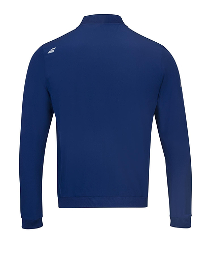 The back view of the Babolat Play Men's Badminton Jacket in Estate Blue displays a small white logo on the upper left shoulder. With long sleeves and a ribbed hem, this jacket projects a clean, sporty appearance ideal for winter evenings. It's crafted from four-way stretch fabric to enhance comfort and flexibility.