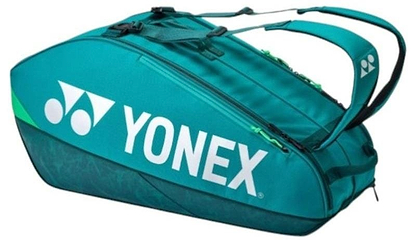 The Yonex 92426EX 6 Racket Pro Badminton Bag in dark green features a large white Yonex logo, zippered compartments, and padded shoulder straps—perfect for carrying up to 6 rackets and your badminton gear.