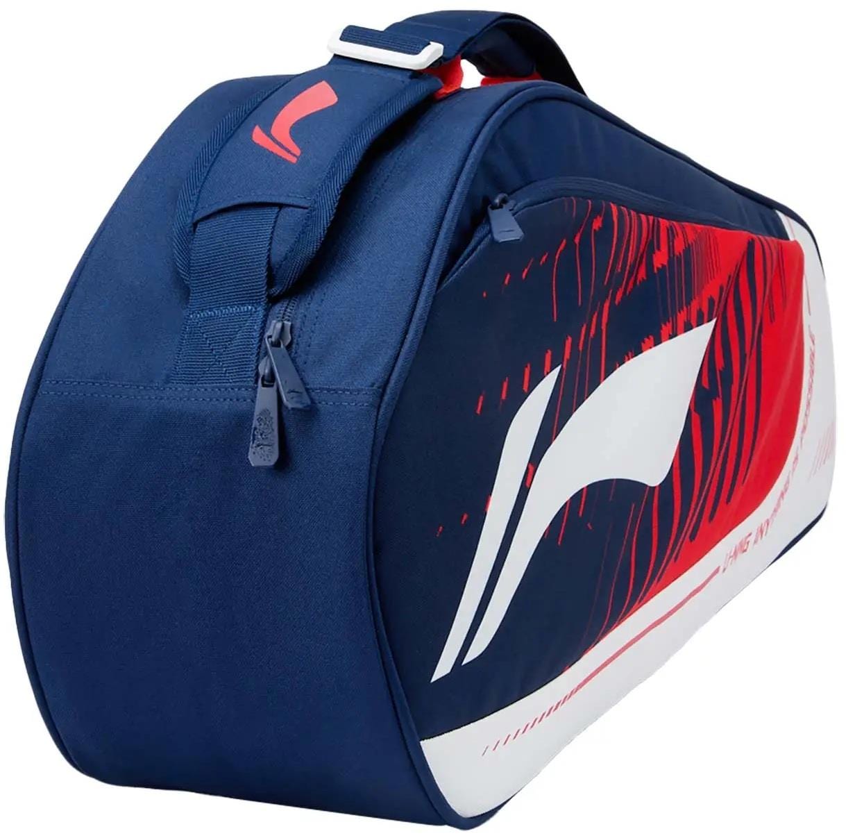 The Li-Ning Training Series 3 Racket Badminton Bag in blue/red features a bold abstract design, white side logo, and top zipper—ideal for carrying your rackets and gear securely.