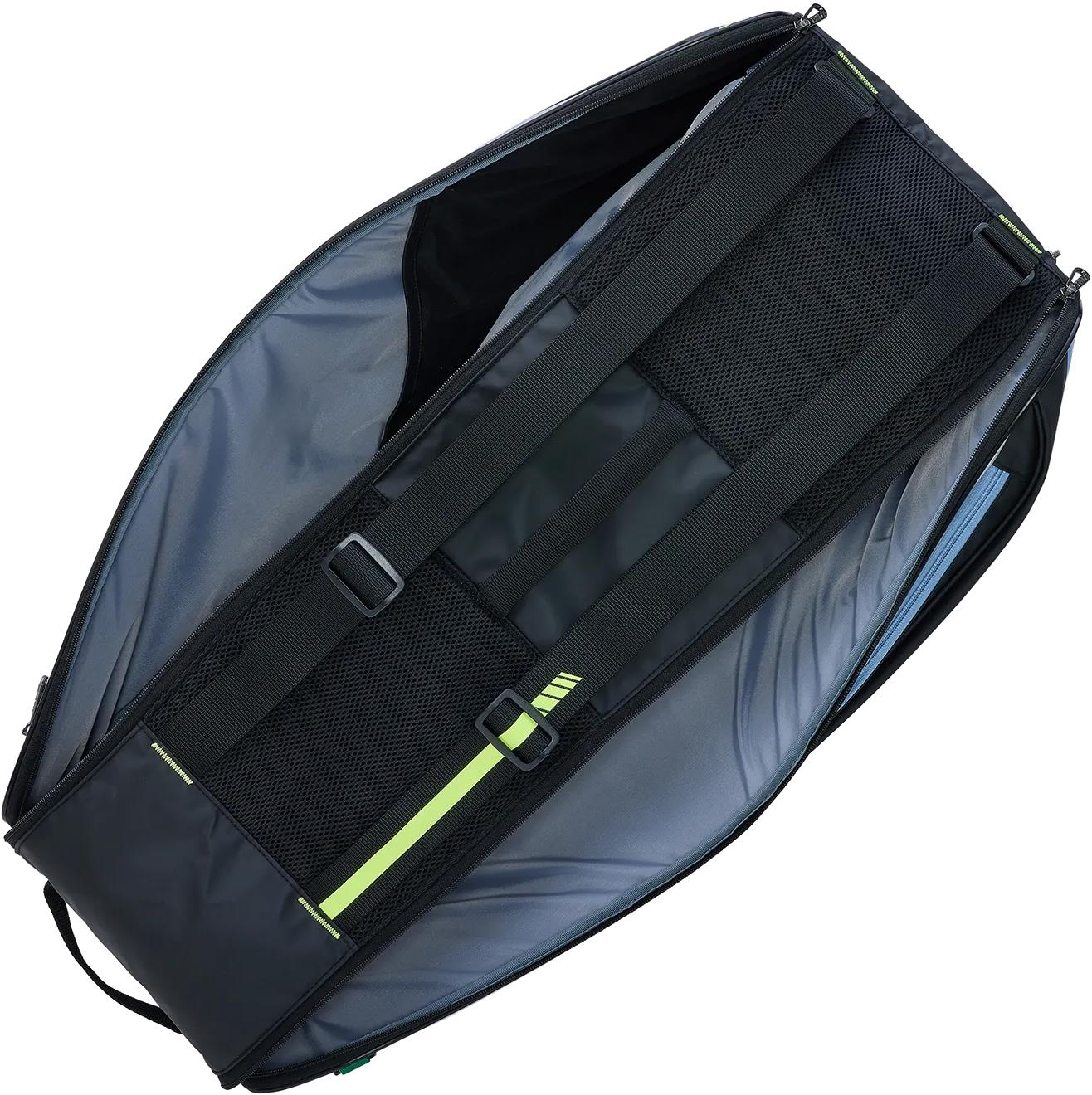 The Yonex BA52526EX Club 6 Racket Badminton Bag in black/blue is open, revealing a spacious interior and two adjustable shoulder straps with green accents inside the flap.