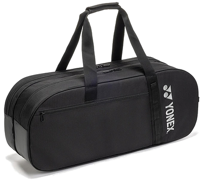 The Yonex BA72631WEX Gearlogic Tournament Badminton Bag in black features two main compartments, double handles, a small front pocket, and a white Yonex logo on the side. Brand: Yonex. Positioned on a white background.