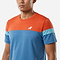 A man wearing the Babolat Crew Neck Men's Badminton T-Shirt - Seaport, featuring an athletic fit with an orange top, blue lower section, and light blue striped sleeves, stands against a plain white background.