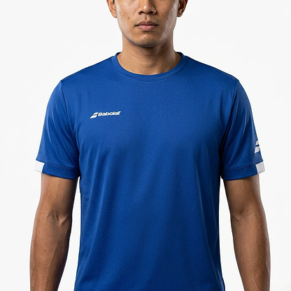 A man wearing the Babolat Play Mens Crew Neck Badminton T-Shirt in Sodalite Blue stands against a white background, arms relaxed at his sides, with white Babolat logos visible on the chest and sleeve.