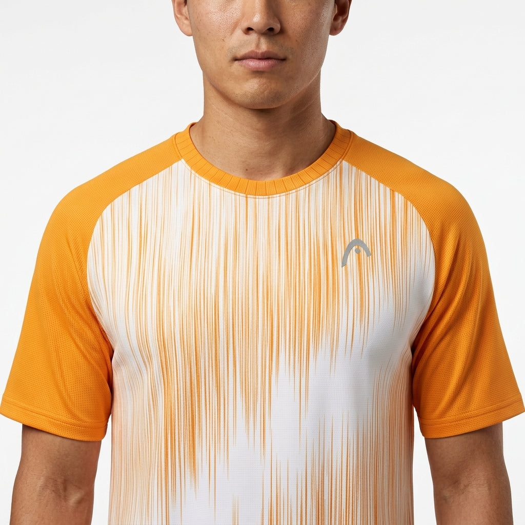 A man wearing the HEAD Performance Mens Badminton T-Shirt - XPBN, an orange and white short-sleeve shirt with vertical streaks and a small left chest logo, shown shoulders up against a plain background.