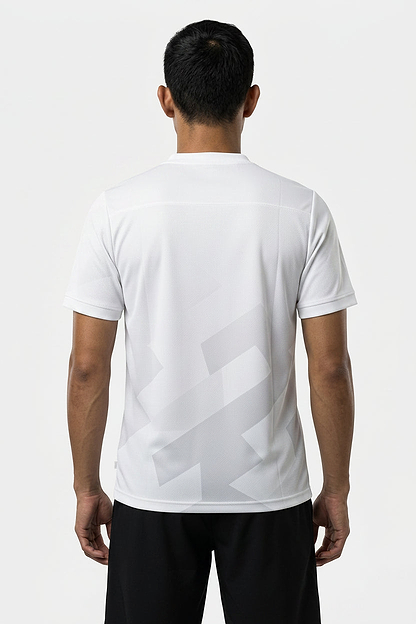 A person with short dark hair, seen from behind, is wearing a white HEAD Pro Men's Badminton T-Shirt - PUXP and black shorts—perfect breathable sportswear by HEAD—set against a plain light background.