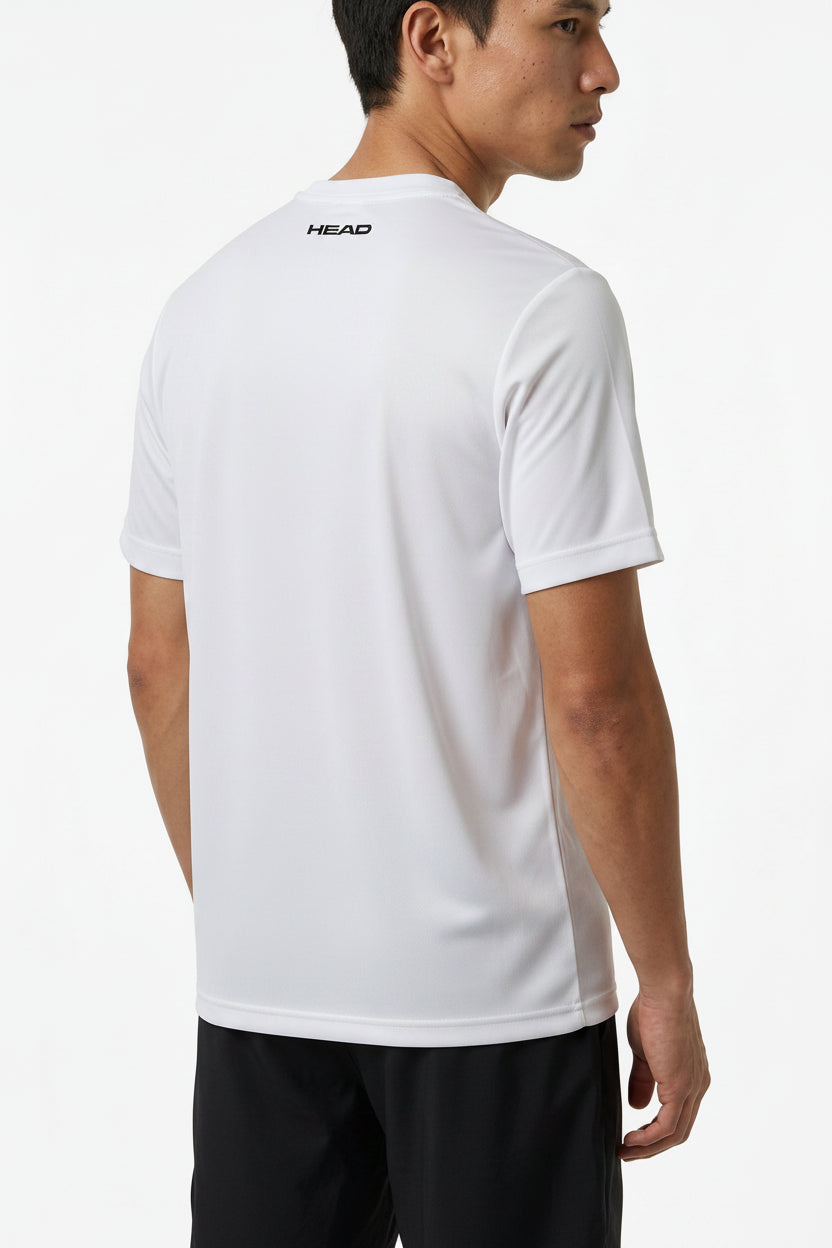 A man stands facing away, wearing a plain white HEAD Pro Mens Badminton T-Shirt - WHXP, featuring moisture-wicking fabric and "HEAD" printed on the upper back, with black shorts against a plain white background.