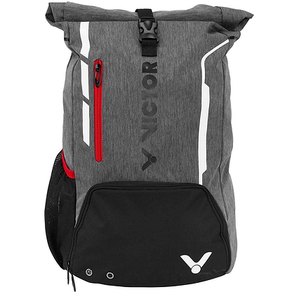 Introducing the Victor Badminton Rucksack 9109, a versatile sports backpack in gray. It features a roll-top closure and a front red zippered pocket. The black base includes a dedicated racket compartment, making it ideal for athletes. Adorned with the "Victor" brand logo and equipped with a mesh side pocket, it provides comfort for all your adventures.